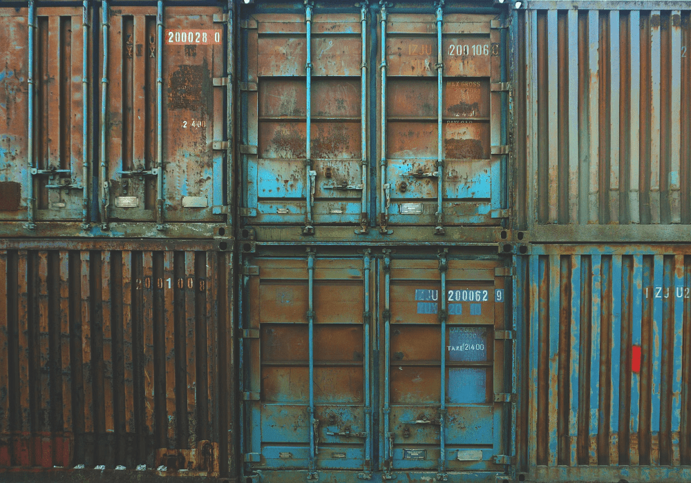 A stack of heavily used shipping containers