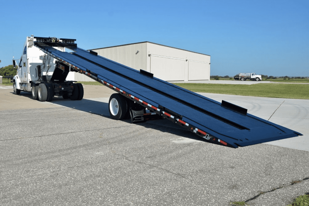 An open trailer bed that is designed to ship a shipping or storage container.
