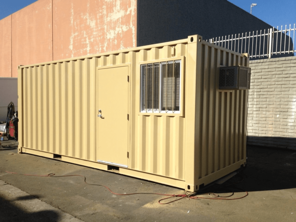 A container office setup outside of a building in a parking lot