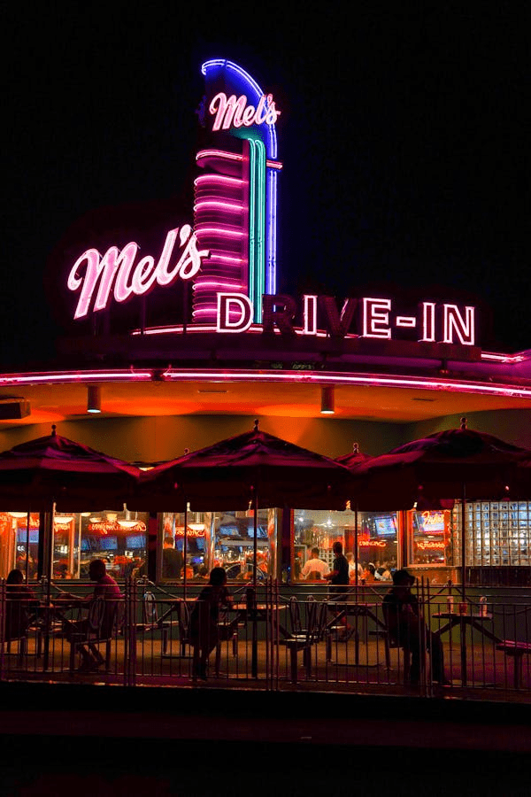 a picture of Mel's diner lit up at night