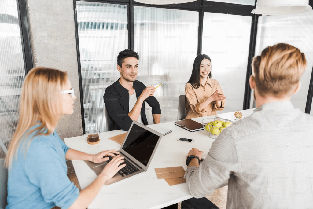 Workers at a desk inside an office building