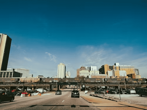 A rail line with downtown Ann Arbor in the background