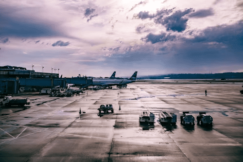 an airport with a plane at a gate