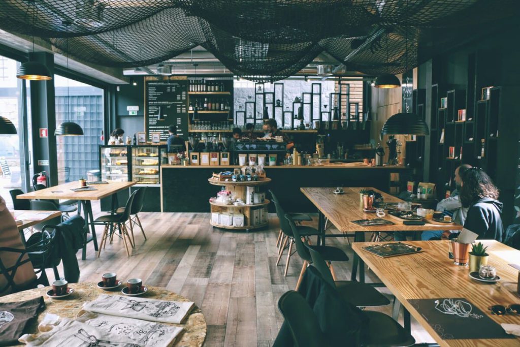 A view from inside a restaurant that uses storage containers to make their space